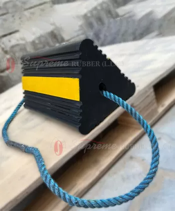Rubber aircraft wheel chock with rope handle